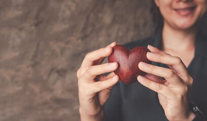 female hands holding red heart, world mental health day and world heart day, Life and health insurance, concept of love.