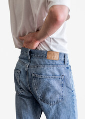 Man in blue jeans with tag studio shot