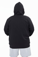 Men's black hoodie mockup fashion shoot in studio