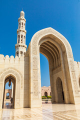 Fototapeta na wymiar Middle East, Arabian Peninsula, Oman, Muscat. Entrance to the Sultan Qaboos Grand Mosque in Muscat.