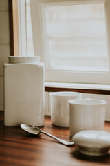Coffee white porcelain jars on kitchen counter