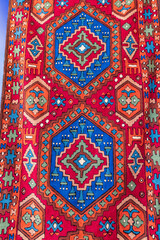 Middle East, Arabian Peninsula, Oman, Muscat, Muttrah. Rugs for sale at the souk in Muttrah.