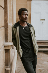 Obraz premium Men's green jacket mockup with black tee on African American model