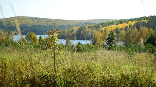 Autumn landscape with hills and lake. Slider. Dolly