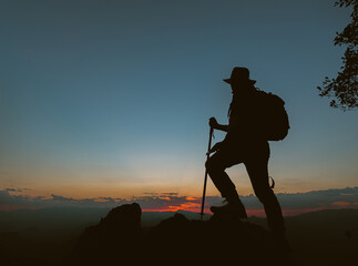 silhouette of man standing on the mountain,success concept scene