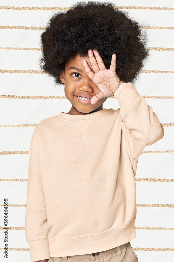 Sticker Black boy wearing cream sweater in studio