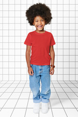 Black boy wearing t-shirt with pants in studio