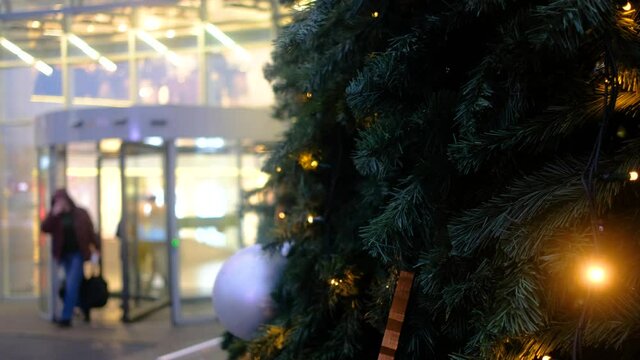 Close-up of a beautiful Christmas tree decorated with christmas balls on street