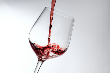 Red wine pouring into a wine glass