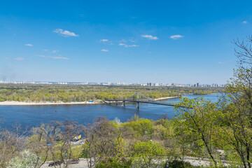 Landscape of riverbank and River of Dnieper against blue sky, view from the The Volodymyrska hill