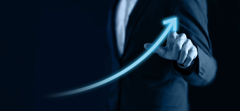 business concept, business man try to predict economic by point and dragging the growth graph to make a benefit, profit, trend, market, success, grow up, turnover, financial,moeny