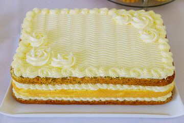 Festive layer cake decorated with white icing.
