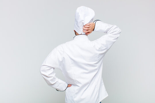 bald man thinking or doubting, scratching head, feeling puzzled and confused, back or rear view