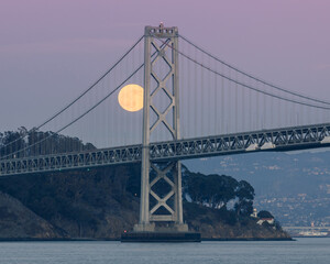 Full moon rising over the Bay Bridge and Treasure Island, San Francisco CA