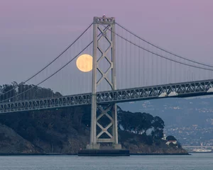 Poster Full moon rising over the Bay Bridge and Treasure Island, San Francisco CA © Yuval Helfman
