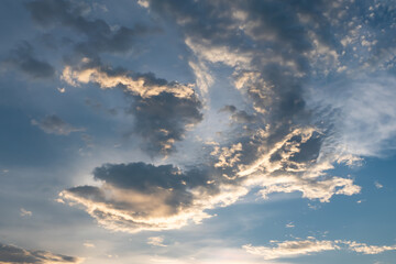 Naklejka na ściany i meble Bird shaped cloud against blue sky in evening.