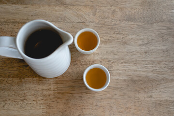 Set of simple white Chinese tea on a wooden table.
