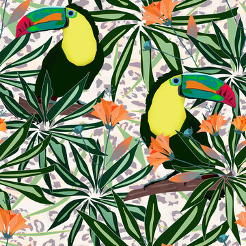 Seamless tropical pattern. Toucan birds with palm leaves on a beige leopard background.