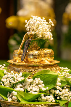 A beautiful gold tepak sireh for wedding dowry decorate with betel leaves and baby breath flower