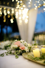 a beautiful flower decoration on a dinning table