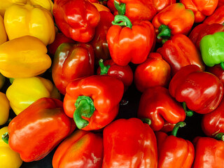 lots of ripe red peppers for cooking as a background