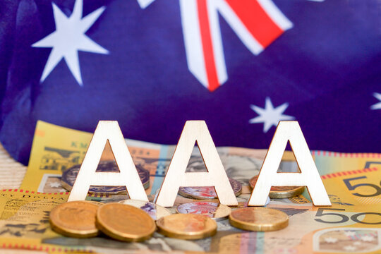 Triple A rating concept with Australian dollars and flag in the background.