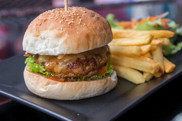 Cheeseburger with French fries and salad