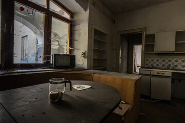 kitchen with television on the windowsill from a abandoned house