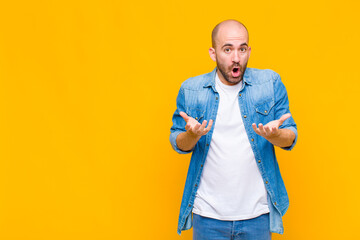 bald man open-mouthed and amazed, shocked and astonished with an unbelievable surprise