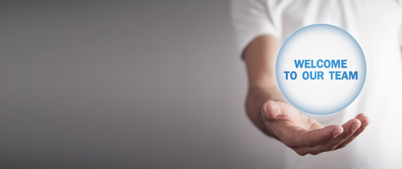 Man holding text Welcome To Our Team.