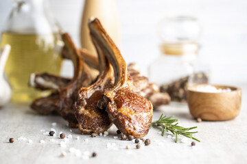 Grilled lamb chops on kitchen table.