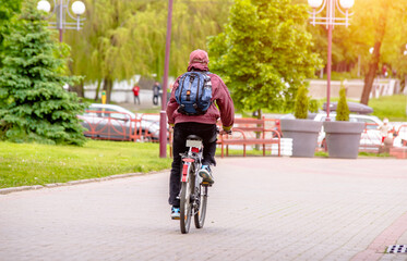 Cyclist ride on the bike path in the city Park
