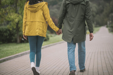 Close up picture of a couple walking in the park