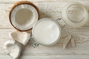 Fresh coconut and coconut milk on wooden background
