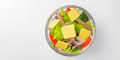 Serving of healthy vegetable salad with meat in a bowl. Delicious snack, healthy eating, isolated on white background.
