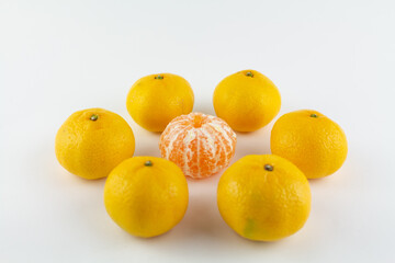 beautiful ripe tangerines on a white background