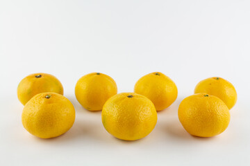 beautiful ripe tangerines on a white background