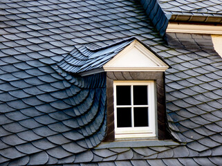 window on the with slates covered roof