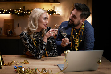  Happy couple make a New Year's Eve toast