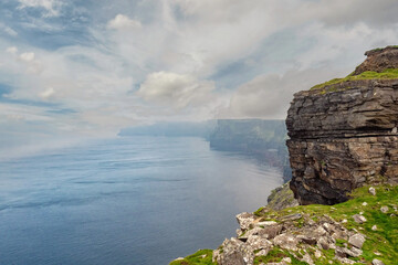 Epic view of rock structure of Cliff of Moher, county Clare, Ireland. Cloudy sky. Nobody.