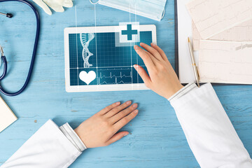 Top view of doctor hands with tablet computer