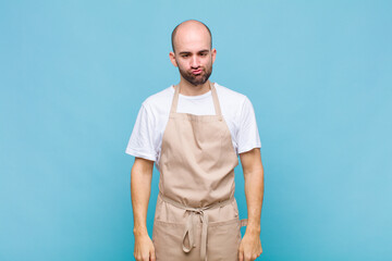 bald man looking goofy and funny with a silly cross-eyed expression, joking and fooling around