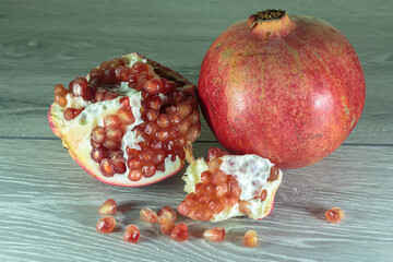 Juicy ripe pomegranates. Concept of vegan food.