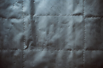 The wall is covered with tin.