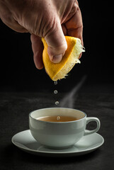 A few drops of lemon added to a steaming cup of tea