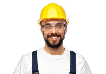 profession, construction and building - happy smiling male worker or builder in yellow helmet and overall over white background