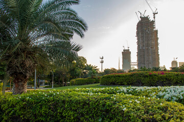 Shot from inside of a one of the most popular parks in Dubai. Zabeel park. UAE. Landmarks such Burj Khalifa, tallest building in the world and world trade center building can bee sen on the scene © Four_Lakes