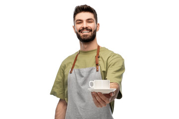 people, profession and job concept - happy smiling waiter or barista in apron holding cup of coffee over white background - obrazy, fototapety, plakaty
