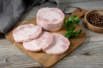 Ham. Spiced ham on a wooden serving Board. Delicious Turkey ham. The sausage product	
