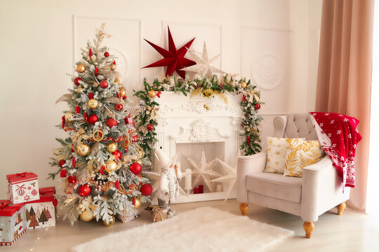 New Year's interior with Christmas tree, fireplace, pillows. Very beautiful photo for Christmas